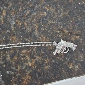 A necklace that has a pendant with a freshwater pearl in it